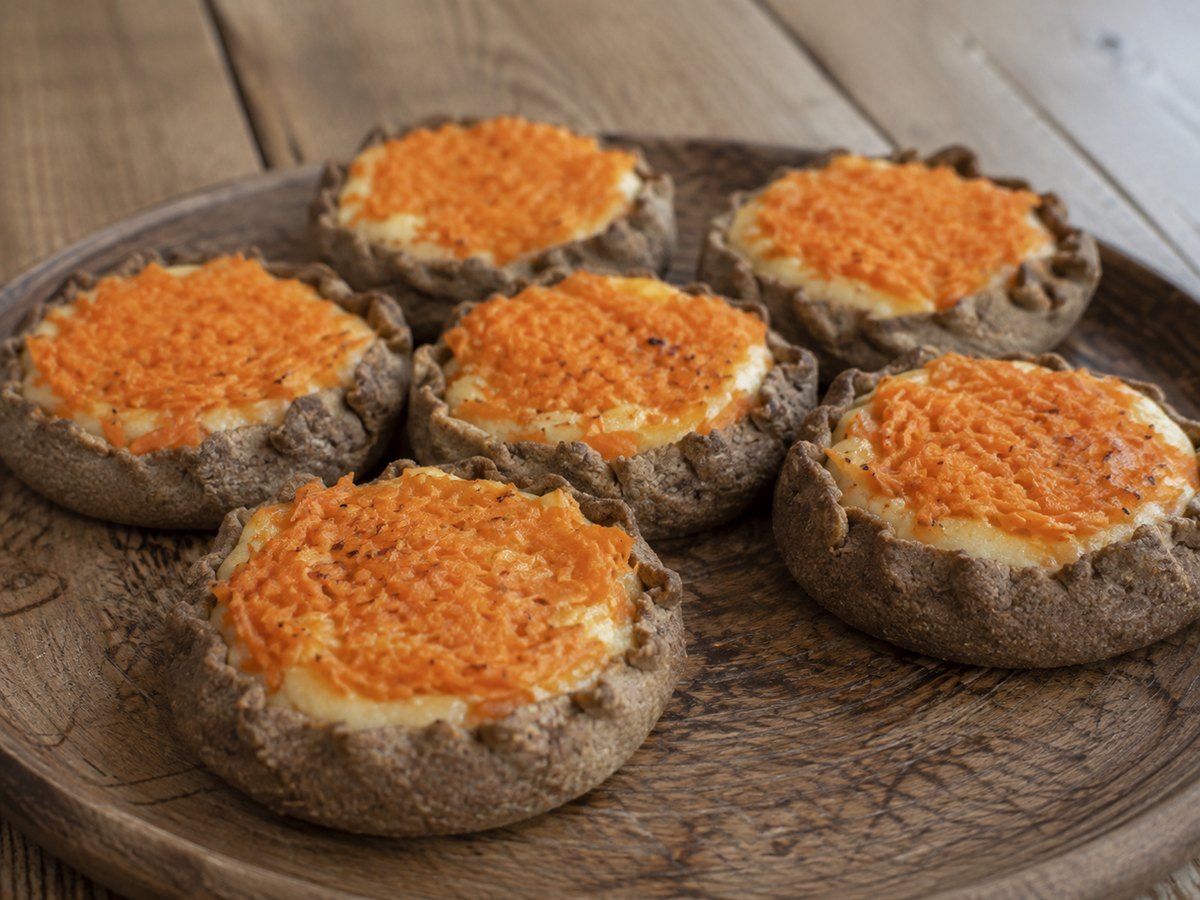 Traditional Latvian sklandrausis rye tarts with potato and carrot layers