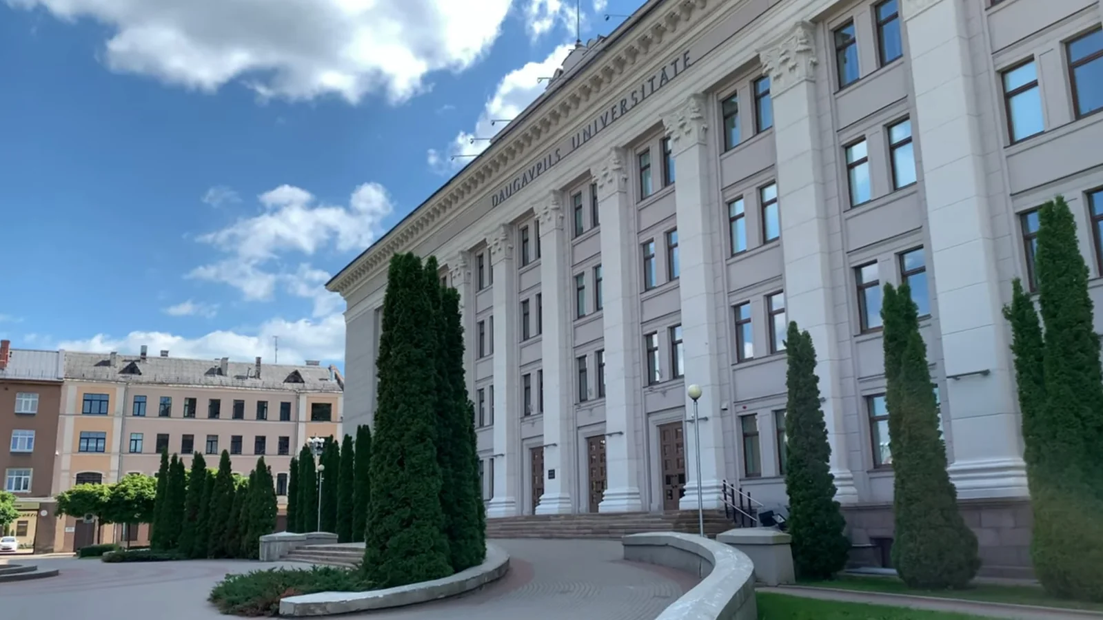 Daugavpils University main building beside its landscaped forecourt