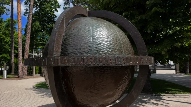 Jūrmala Globe sculpture among pine trees in Majori