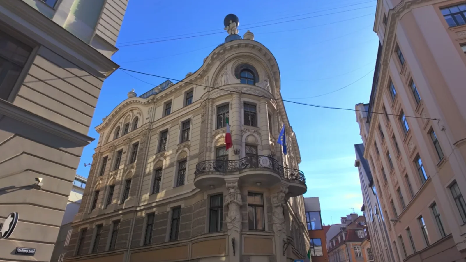 Ornate historic building on Teātra iela in Riga Old Town beneath a blue sky